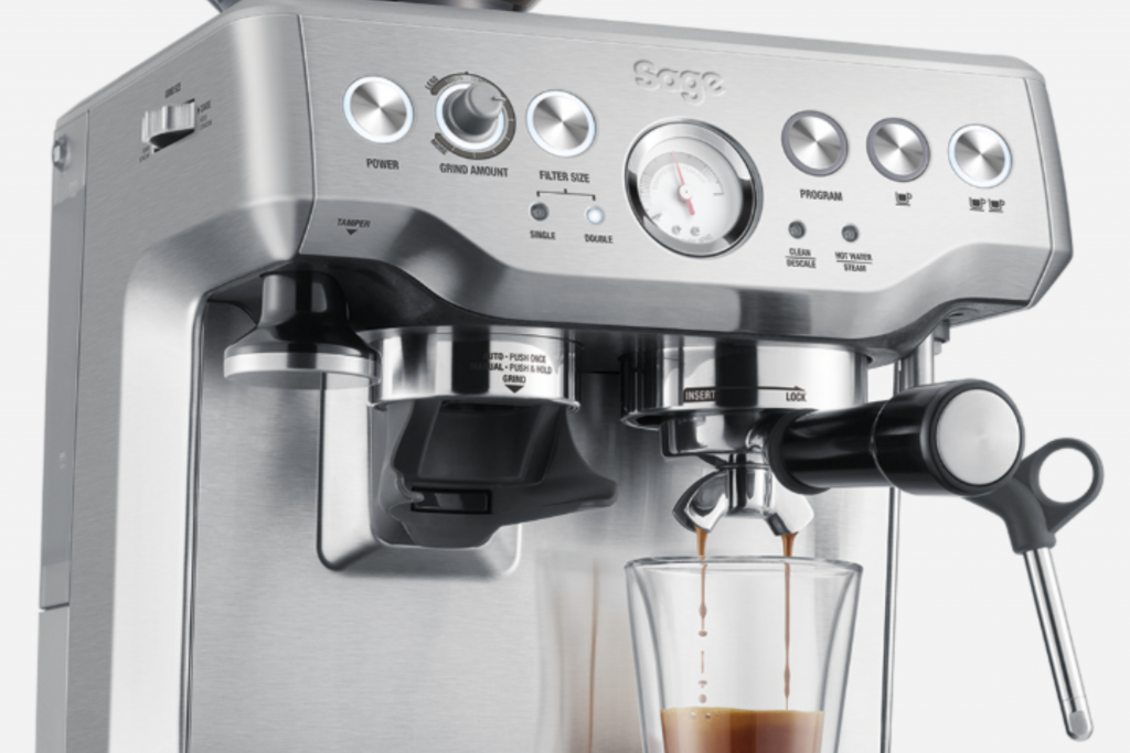 a domestic espresso machine dropping a double shot of espresso