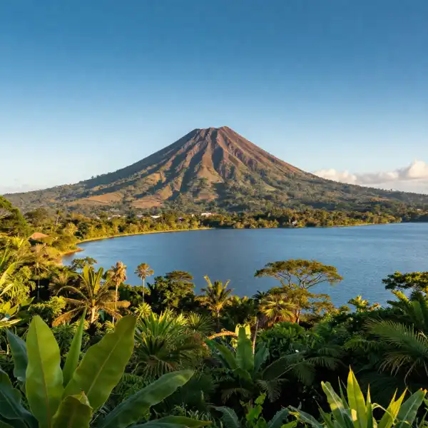 Nicaragua — a volcanic cone rising from a blue lake with lush tropical greenery.
