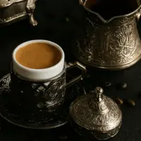 Copper ibrik heating over a flame as finely ground Turkish coffee begins to foam